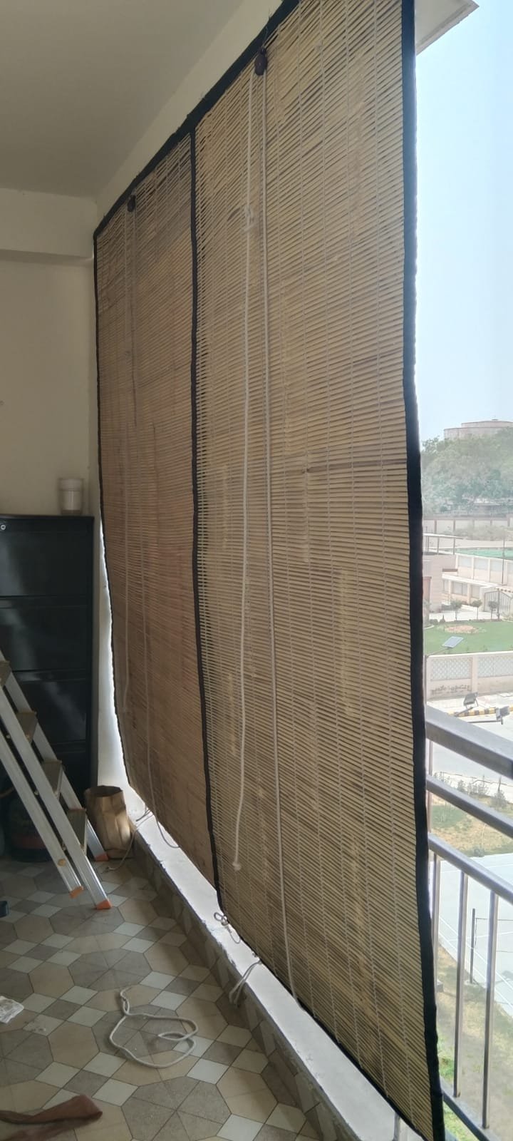 Bespoke balcony chick blind with heavy black border reinforcement tape
