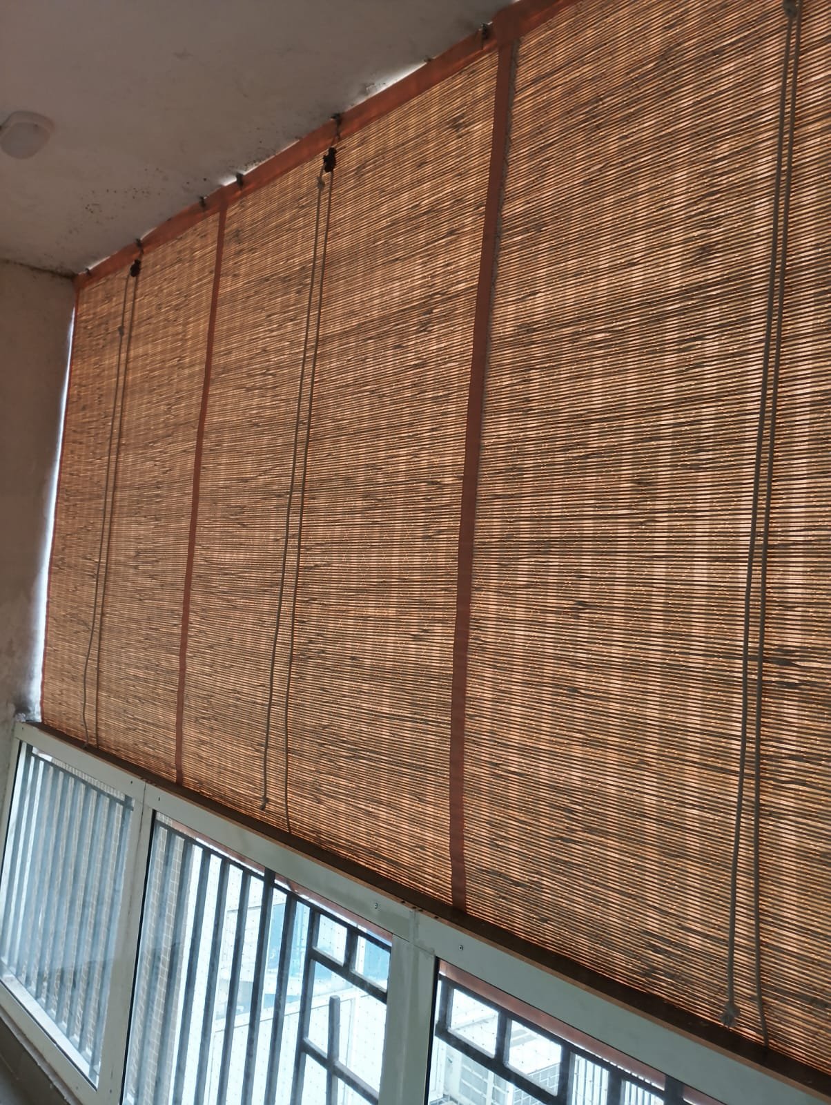 Tightly woven bamboo chick blind providing optimal heat and UV reduction