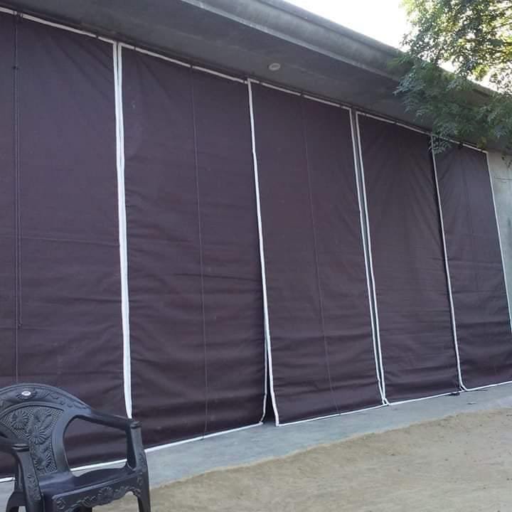 Full-height brown outdoor canvas blind for residential veranda and balcony